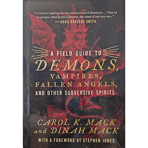 Cover of A Field Guide to Demons by Carol K. Mack and Dinah Mack, featuring red demon illustrations and bold, gold and white typography.