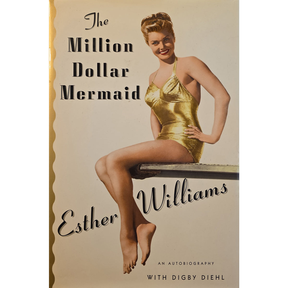 Book cover for 'The Million Dollar Mermaid' by Esther Williams, featuring a vintage photograph of Esther Williams in a gold mermaid swimsuit sitting on a bench, with the title and author name in black text on a cream background.