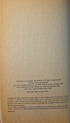 A close-up of a book's copyright page on aged, warm beige paper, showing small black printed text and publisher information.