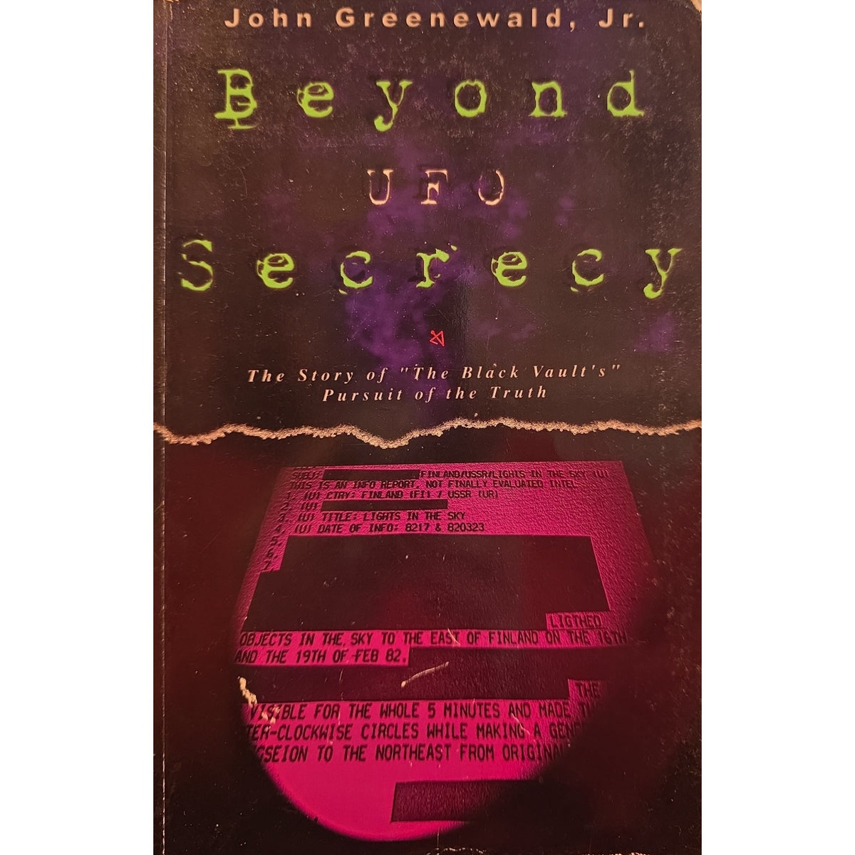 Book cover of 'Beyond UFO Secrecy' by John Greenewald, Jr., featuring a dark textured background with glowing yellow-green title text and a pink-toned graphic near the bottom.