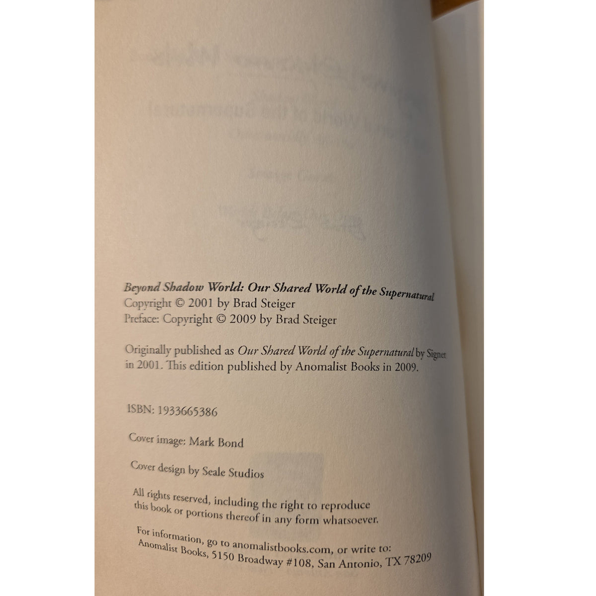 A close-up of a book's copyright page, showing printed text on warm beige paper against a white background.