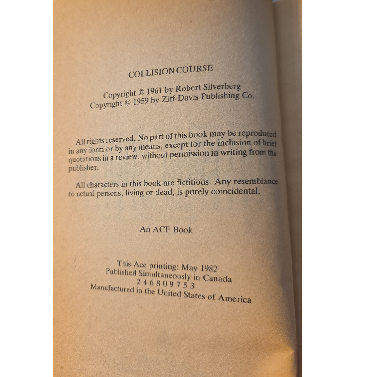 The interior title page of the book 'Collision Course' by Robert Silverberg, published by Ace Book. The page is printed on warm, tan paper with black text detailing copyright information, publisher credits, and manufacturing details.