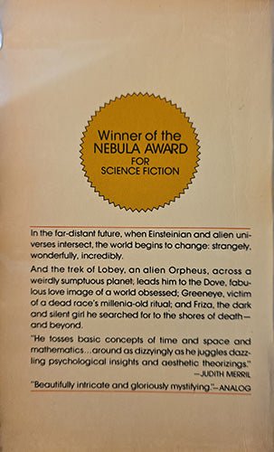 A beige book cover or printed cover page featuring a gold circular seal that reads 'Winner of the Nebula Award for Science Fiction' and several paragraphs of black text below.