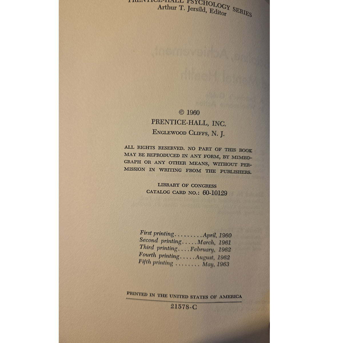 A close-up of a book's title page or copyright page from Prentice-Hall, Inc., showing printed text on aged beige paper against a dark background.