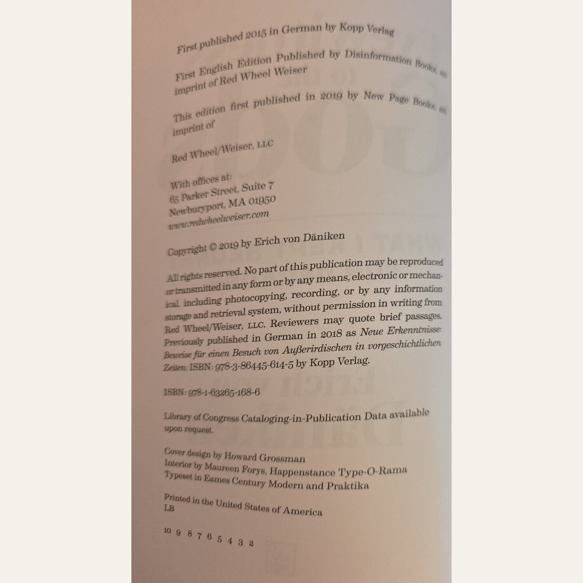 A close-up of a book's printed copyright page showing publication details and publisher information for 'Red Wheel Weiser' on a light beige paper background.