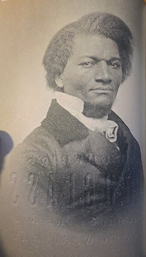Historic photographic portrait of Frederick Douglass reproduced inside Frederick Douglass: Prophet of Freedom