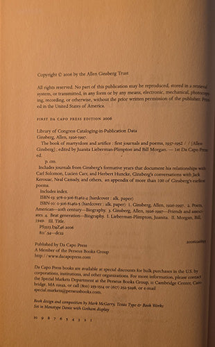 A close-up of a book's printed copyright page in warm tan paper, showing black text and publisher details including Allen Ginsberg Trust and Di Capo Press.