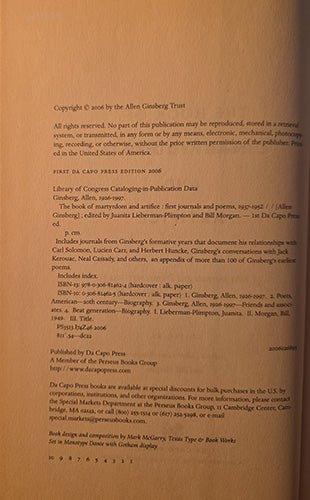 A close-up of a book's printed copyright page in warm tan paper, showing black text and publisher details including Allen Ginsberg Trust and Di Capo Press.