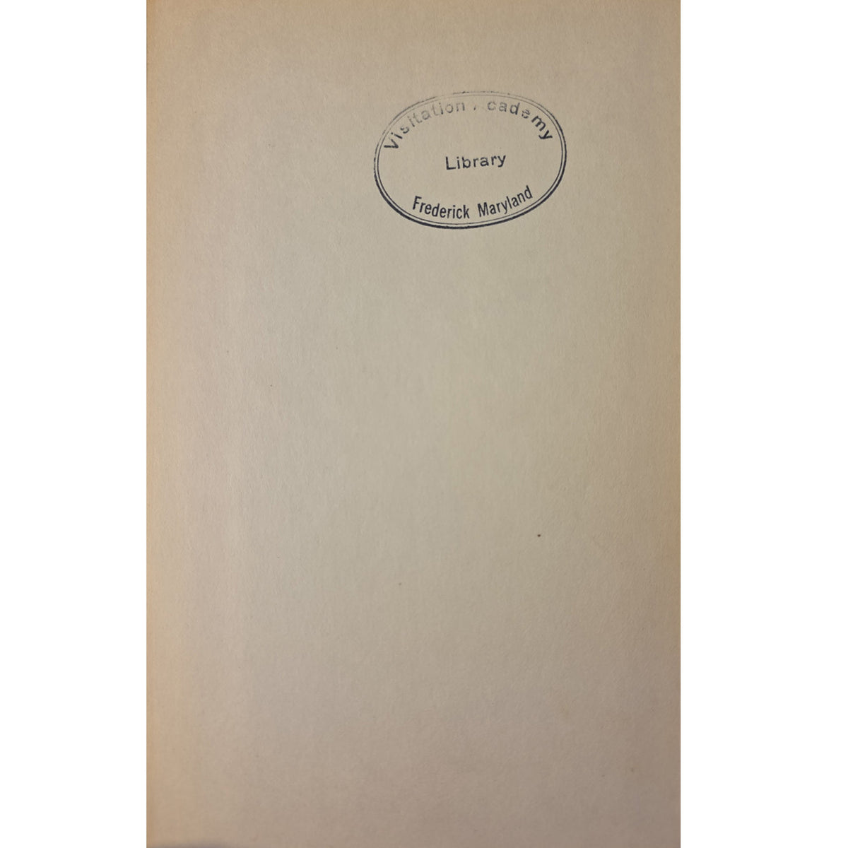 A close-up of a beige paper page with a circular library stamp reading 'Wittenberg Library Frederick Maryland' near the top center.