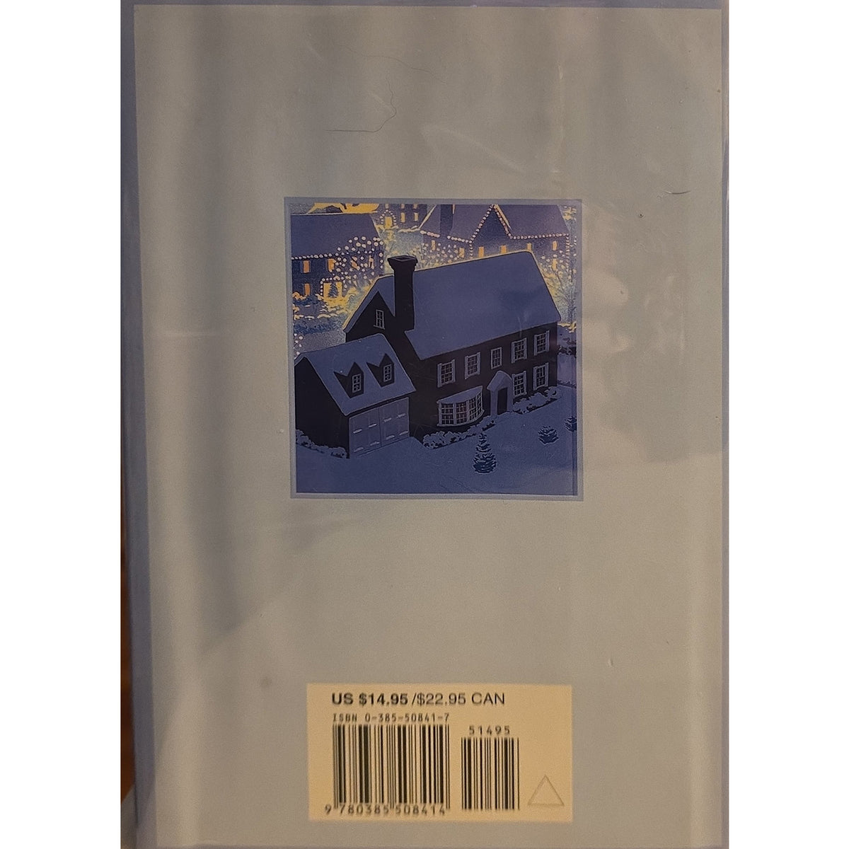 The back cover of a book or booklet wrapped in protective plastic, featuring a small central illustration of a snowy house in blue and purple tones and a barcode label at the bottom.