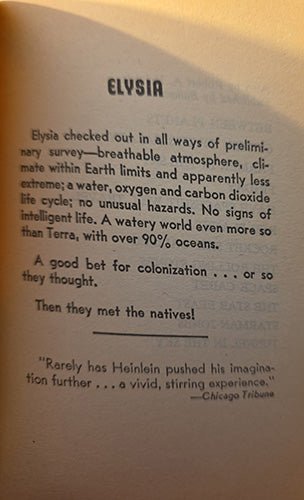 A close-up of printed text on a beige paper background, with the heading 'ELYSIA' and several paragraphs of black text including a quote from the Chicago Tribune.
