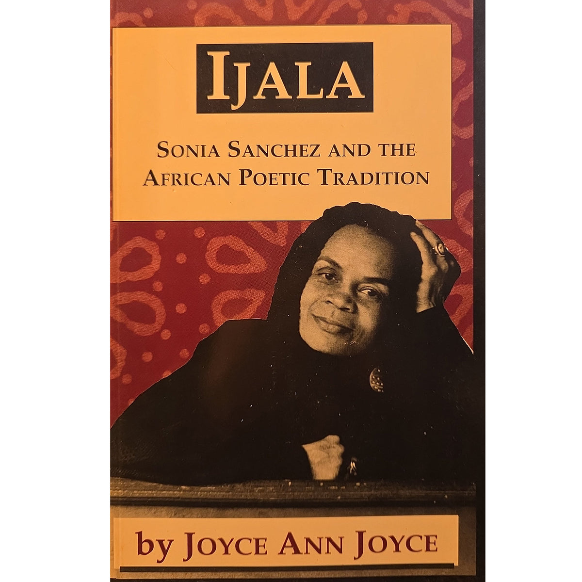 Book cover for 'Ijala: Sonia Sanchez and the African Poetic Tradition' by Joyce Ann Joyce, featuring a portrait of Sonia Sanchez against a red patterned background with tan title panels.