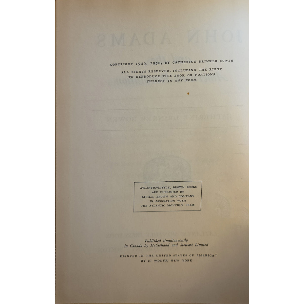 A vintage book's title and copyright page in a warm beige tone, featuring black printed text and faint embossed lettering.