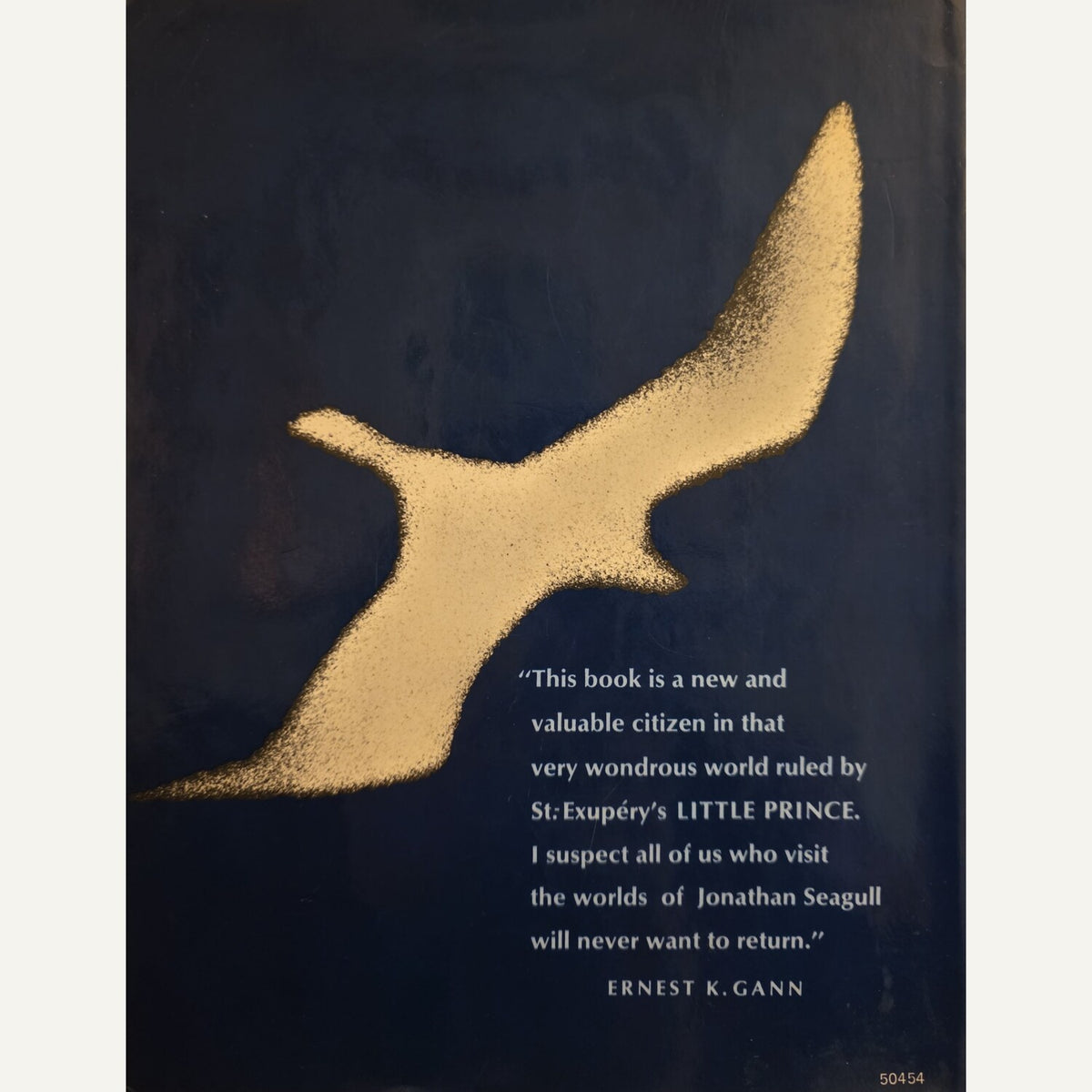 A book cover featuring a large textured gold bird silhouette on a dark navy background, with a white quote from Ernest K. Gann on the lower right.