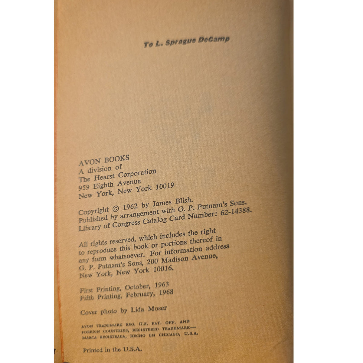 The back cover of a vintage book showing printed copyright and publisher information on warm tan paper.