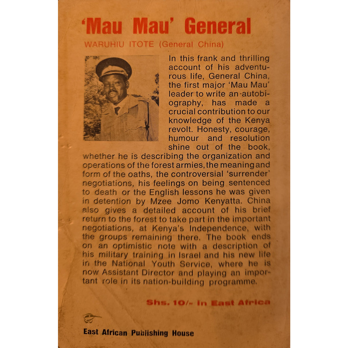 The back cover of the book 'Mau Mau' General' by Waruhiu Tote, published by East African Publishing House. The cover is a warm, textured tan-brown with red title text at the top and a black-and-white illustration of a soldier in a helmet.
