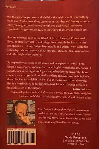The back cover of the book 'Monsters' by Brad Steiger, published by Galde Press. The cover is dark reddish-brown with white text, a barcode, and a small author portrait photo in the lower-left corner.