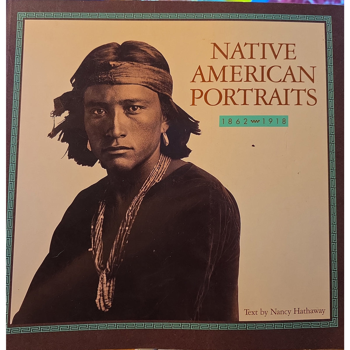 Native American Portraits 1862–1918 by Nancy Hathaway, featuring a sepia portrait framed by a turquoise patterned border.