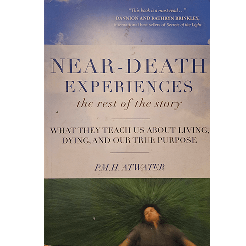 Book cover of Near-Death Experiences: The Rest of the Story by P.M.H. Atwater featuring a person lying in green grass and a dramatic sky.