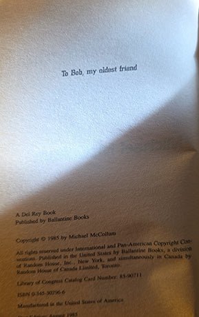 A close-up of a printed book page with the heading 'To Bob, my oldest friend' and publication details for 'A Del Ray Book' published by Ballantine Books.