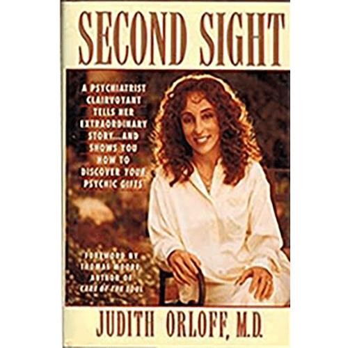 First edition hardcover of Second Sight by Judith Orloff, M.D., featuring the author seated warmly on the cover, wearing a white blouse, smiling.