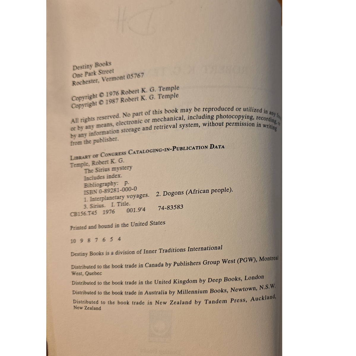 A close-up of a book's printed interior page showing publication details, including the title 'The Sirius mystery' and publisher information for Destiny Books.