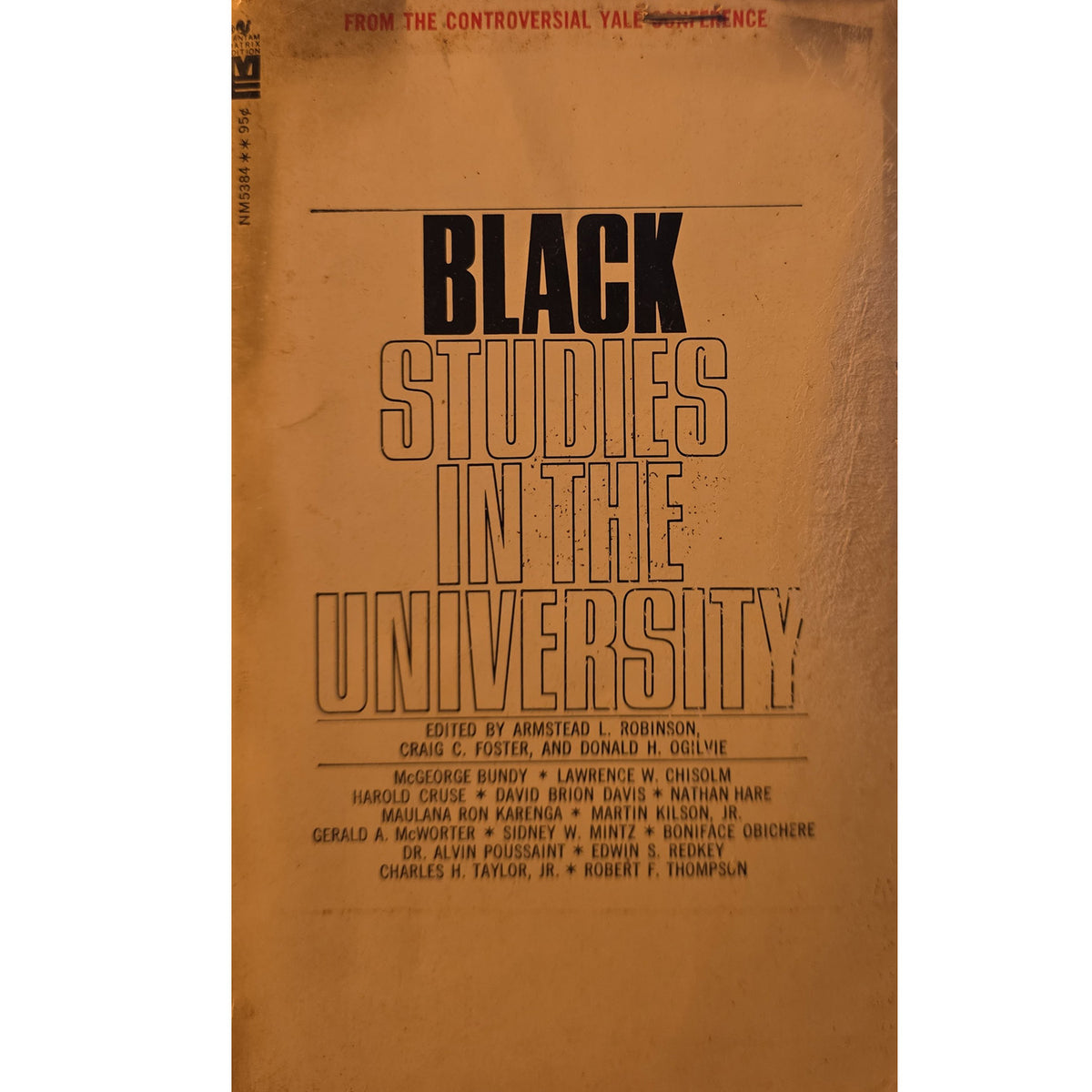 A vintage book cover for 'Black Studies in the University' with a warm tan/brown background and bold black typography.