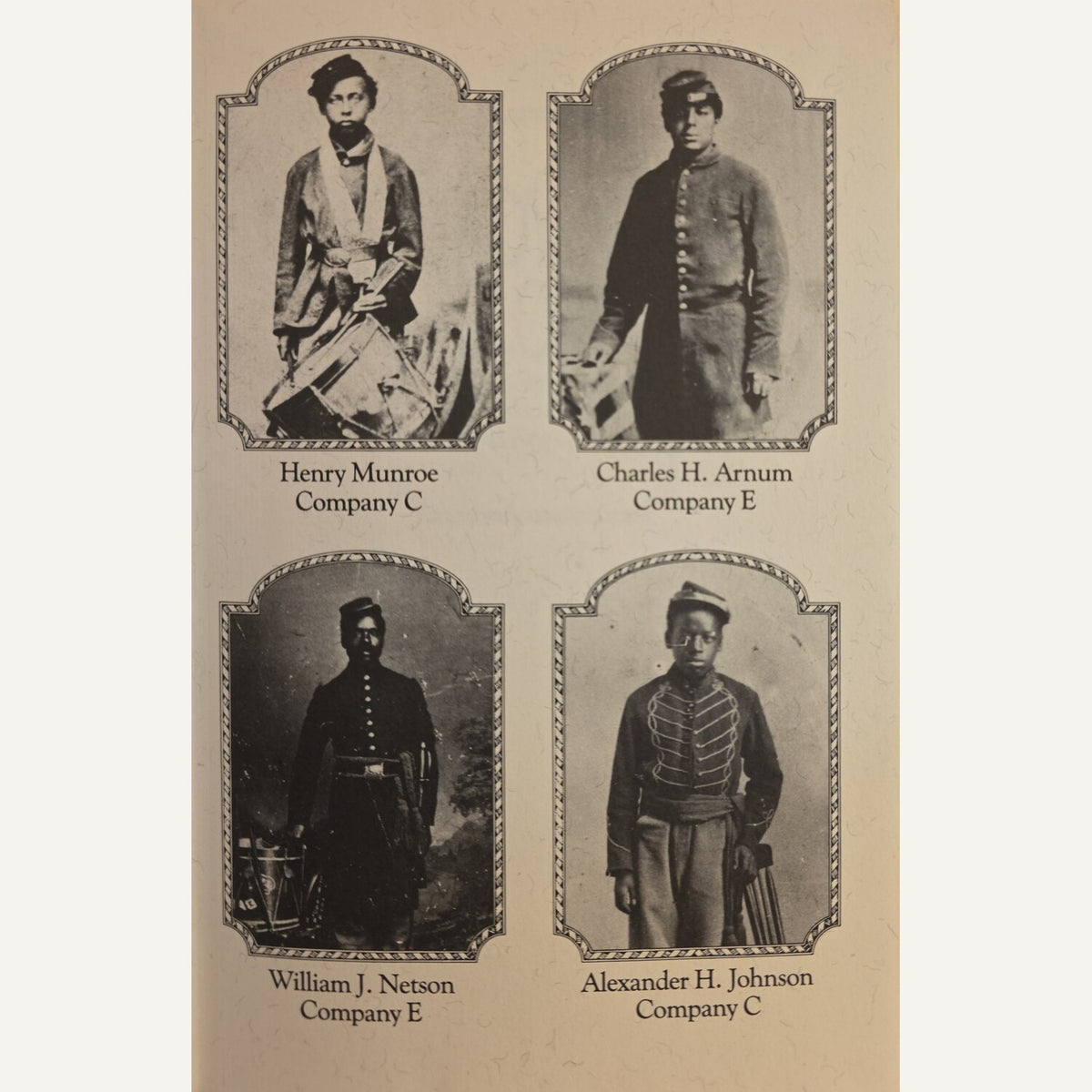 Vintage printed card or poster showing four sepia-toned portrait photographs of soldiers in uniform, each labeled with a name and company: Henry Munroe Company C, Charles H. Arnum Company E, William J.