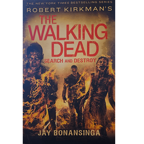 The cover features fiery, decayed zombies emerging from the darkness, symbolizing destruction and relentless horror in The Walking Dead: Search and Destroy