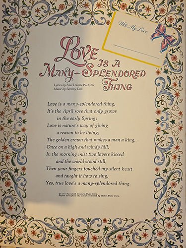 Decorative interior lyric page from vintage song folio featuring ornate border and romantic verse