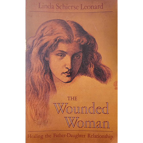 Cover of The Wounded Woman by Linda Schierse Leonard, featuring a sepia-toned sketch of a woman's face with flowing hair on a textured background.