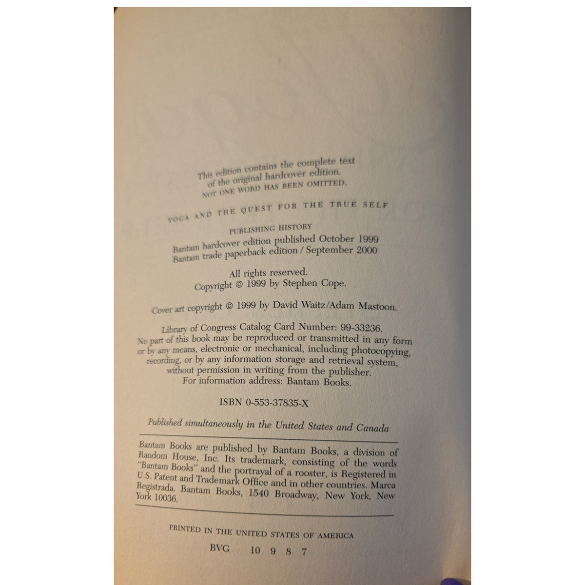 A close-up of a book's interior title page showing printed text and publisher information for 'Yoga and the Quest for the True Self' by Ramana Maharshi, photographed against a neutral background.