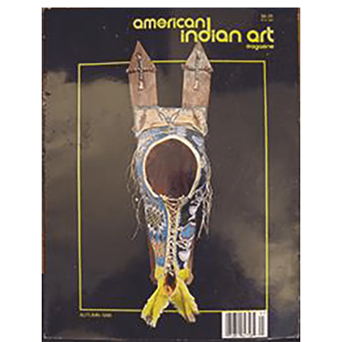 The cover features a detailed Native American headdress adorned with colorful beadwork, feathers, and wooden horns, set against a black background. The title "American Indian Art" is in yellow at the top.