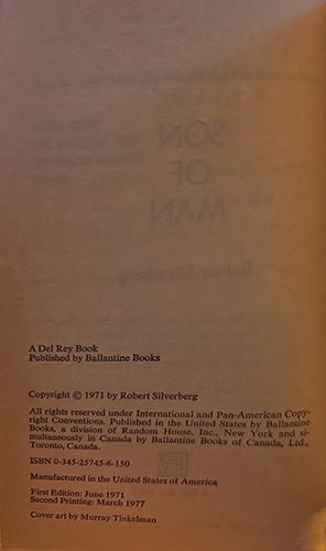 A close-up of a book's printed cover or interior page in warm tan paper tones, showing faint title text and publication details including 'A Del Rey Book', 'Published by Ballantyne Books', and copyright by Robert Silverberg.