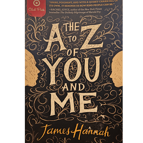 The cover of The A to Z of You and Me by James Hannah features whimsical golden swirls, two profile silhouettes, and bold lettering on a black background, evoking the novel’s themes of reflection and emotion.