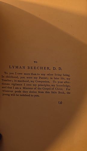 A close-up of an aged, yellowed paper page with printed text addressed 'TO LYMAN BEECHER, D.D.' in black serif lettering.