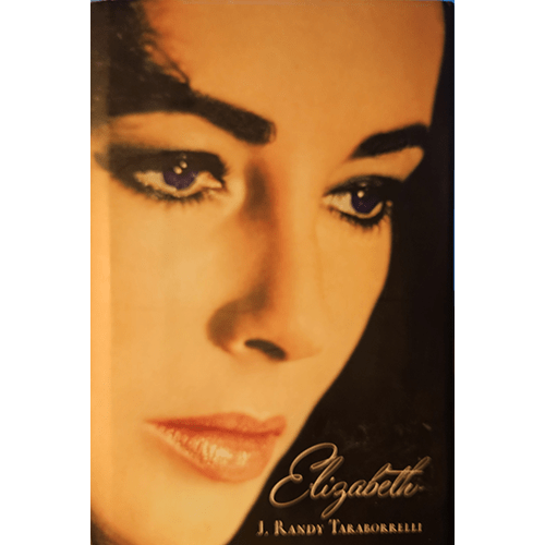 Cover of Elizabeth by J. Randy Taraborrelli features a striking close-up of Elizabeth Taylor’s iconic face, with her dramatic makeup and expressive violet eyes capturing Hollywood's timeless beauty.