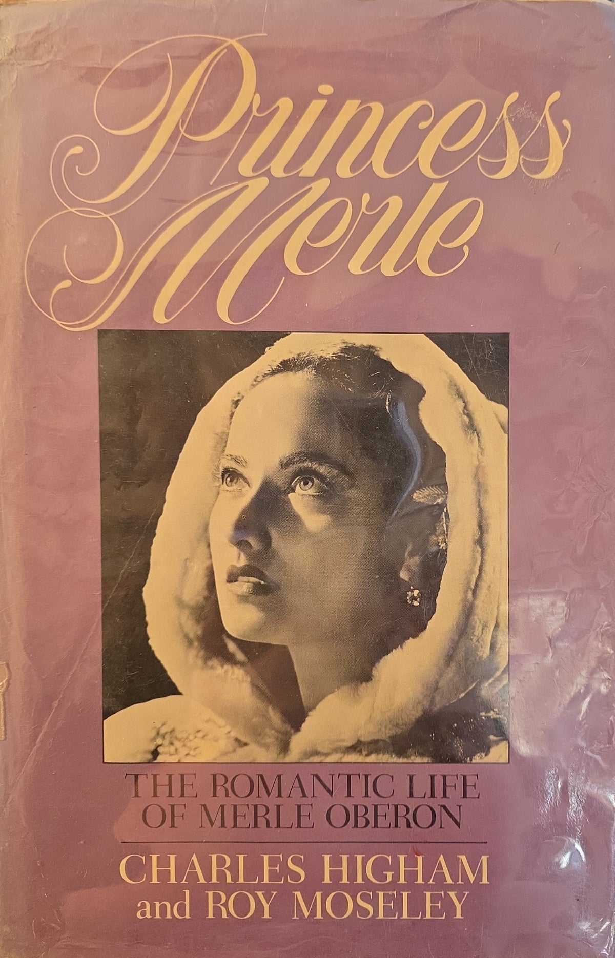 Princess Merle: The Romantic Life of Merle Oberon by Charles Higham and Roy Moseley, with a portrait of Oberon in a white hood.
