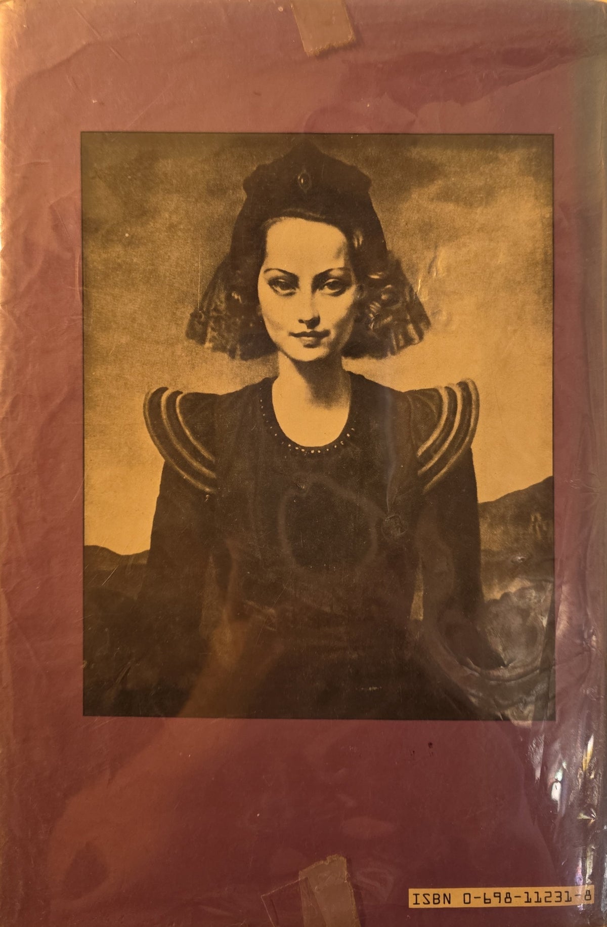 Back jacket of Princess Merle featuring a portrait of actress Merle Oberon in period costume.