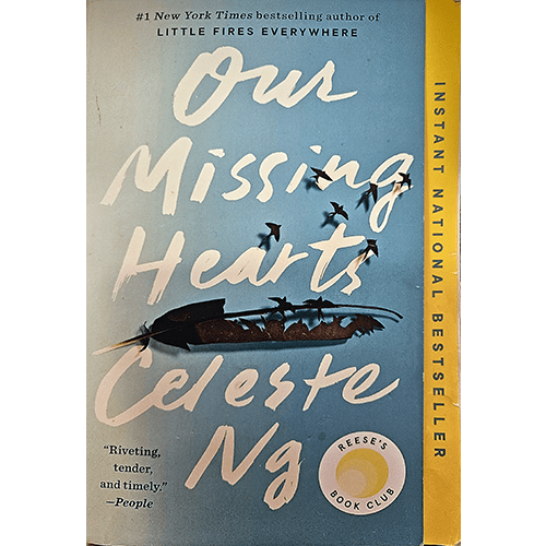 The cover of "Our Missing Hearts" by Celeste Ng, featuring a serene blue background with white, handwritten-style title text, a flock of birds in silhouette, and a Reese’s Book Club seal.