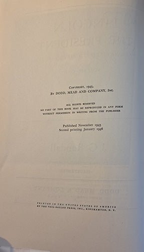 Copyright page of a book with text on a beige background