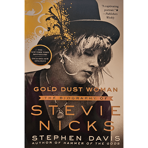 Cover of Gold Dust Woman: The Biography of Stevie Nicks by Stephen Davis features a sepia-toned image of Stevie Nicks in her signature ethereal style, with a hat and necklace, exuding mystique and artistry.