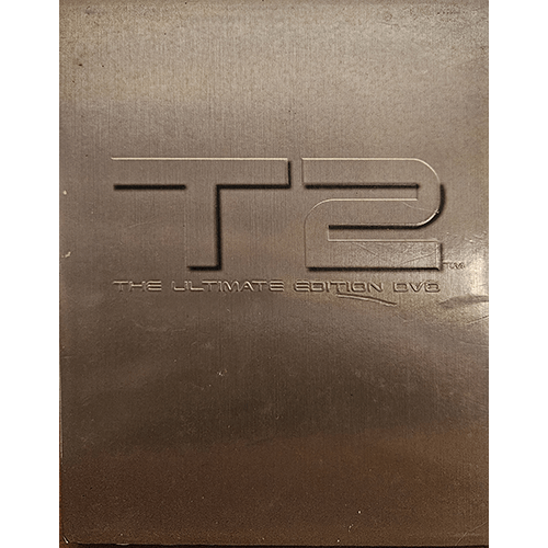 Metallic cover of T2: The Ultimate Edition DVD featuring embossed "T2" text and subtitle "The Ultimate Edition DVD." The special edition of the iconic action sci-fi film Terminator 2: Judgment Day.