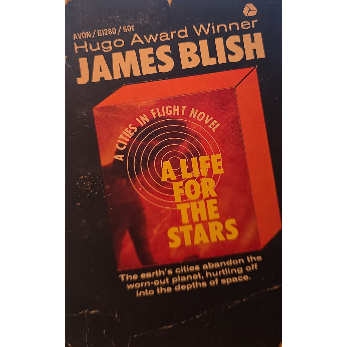 James Blish's 'A Life for the Stars' paperback book cover, published by Avon. The cover features a dark black background with a prominent red-orange 3D box graphic and yellow text.