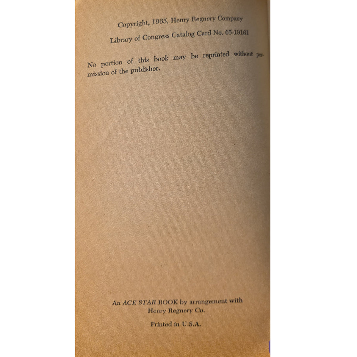 copyright page of the book , showing the title page with printed text on a tan paper background.