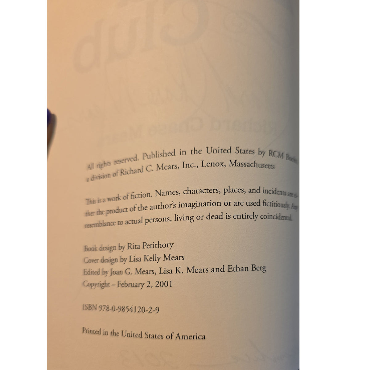 A close-up of a book's printed interior page showing publication details and copyright text on an off-white background.
