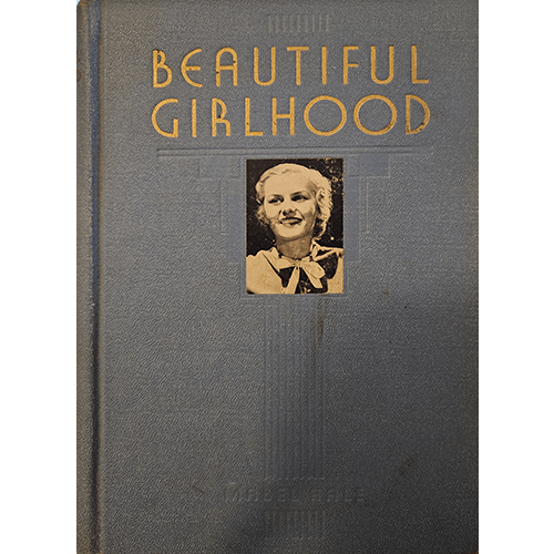 Blue hardcover of Beautiful Girlhood by Mabel Hale, with gold lettering and a black-and-white photograph of a young woman on the front. A 1940 first edition, in fine condition, with an inscription.