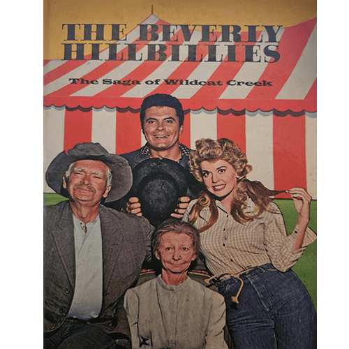 Cover of The Beverly Hillbillies: The Saga of Wildcat Creek, featuring the Clampett family—Jed, Granny, Elly May, and Jethro—posing in front of a circus tent. The book shows age tanning but is in fine condition.