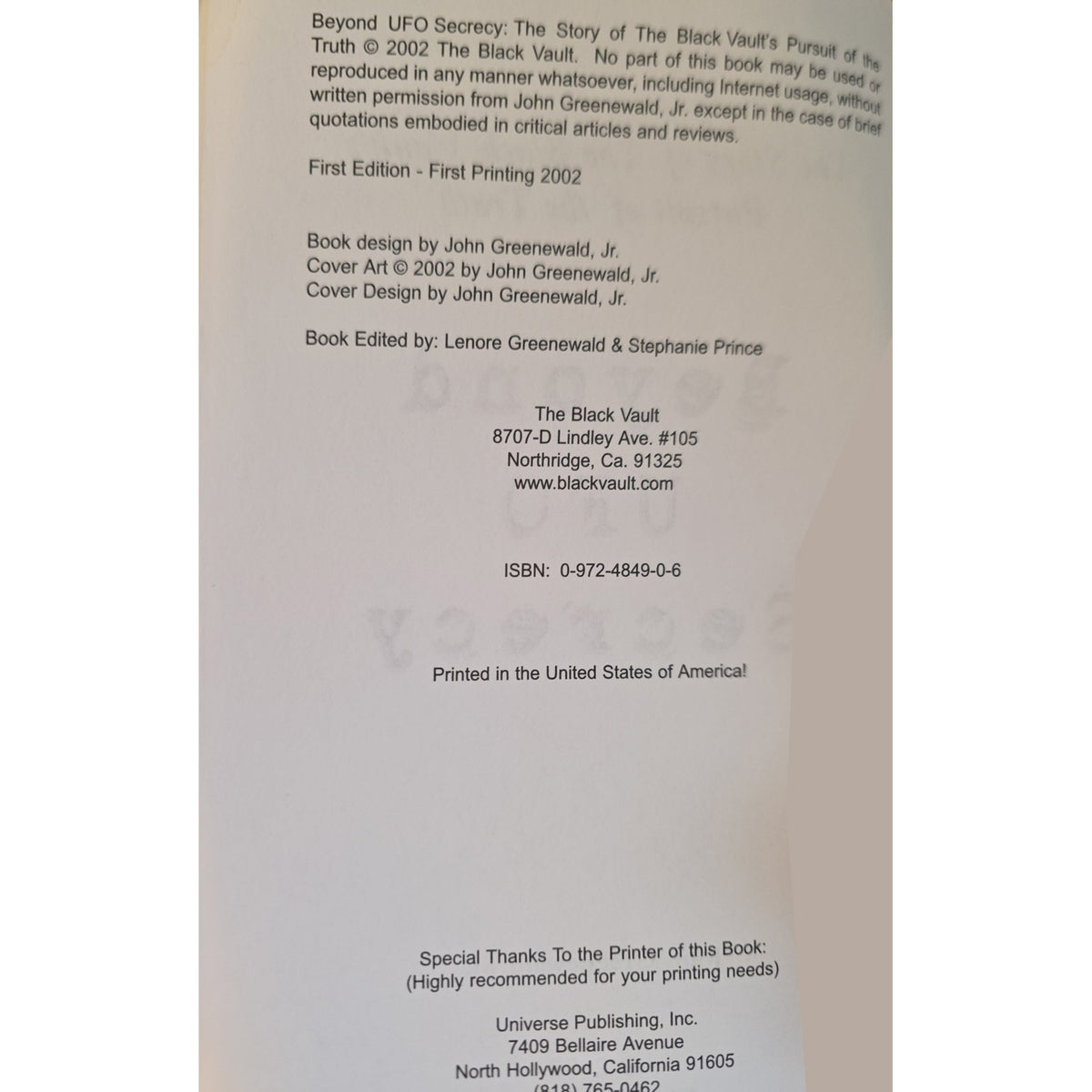 A close-up of a book's printed interior copyright and publisher information page for 'Beyond UFO Secrecy: The Story of The Black Vault's Pursuit of the Truth' by John Greenewald, Jr., showing text and publisher details on a white page.