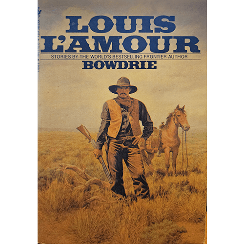 The cover of Louis L'Amour's Bowdrie features a rugged Texas Ranger standing tall in a desert landscape, with his horse nearby, set against a backdrop of muted earth tones that evoke the Old West.